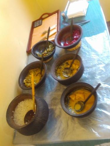 Lunch arranged in clay pots